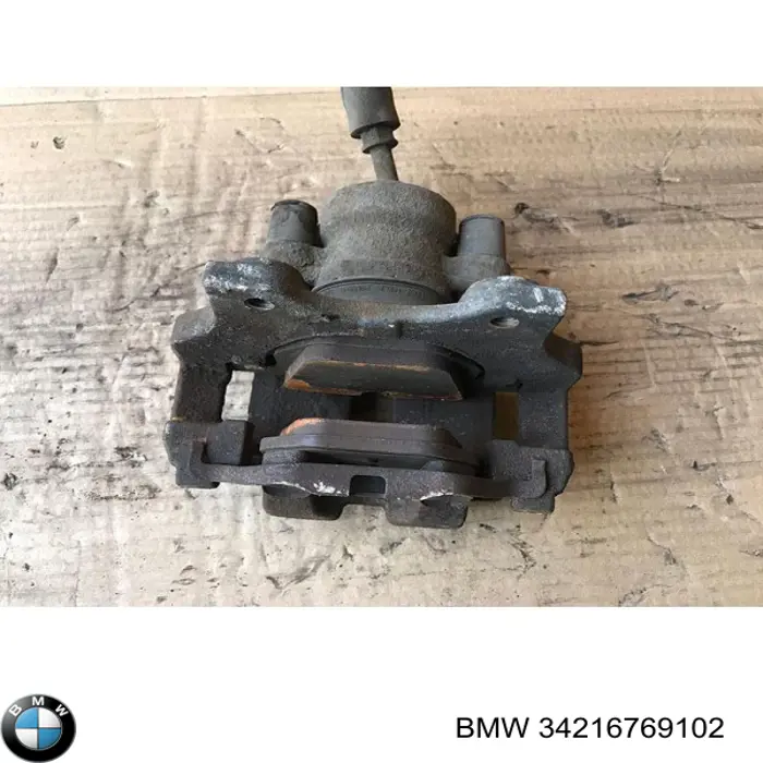 34216769102 BMW Супорт гальмівний задній правий