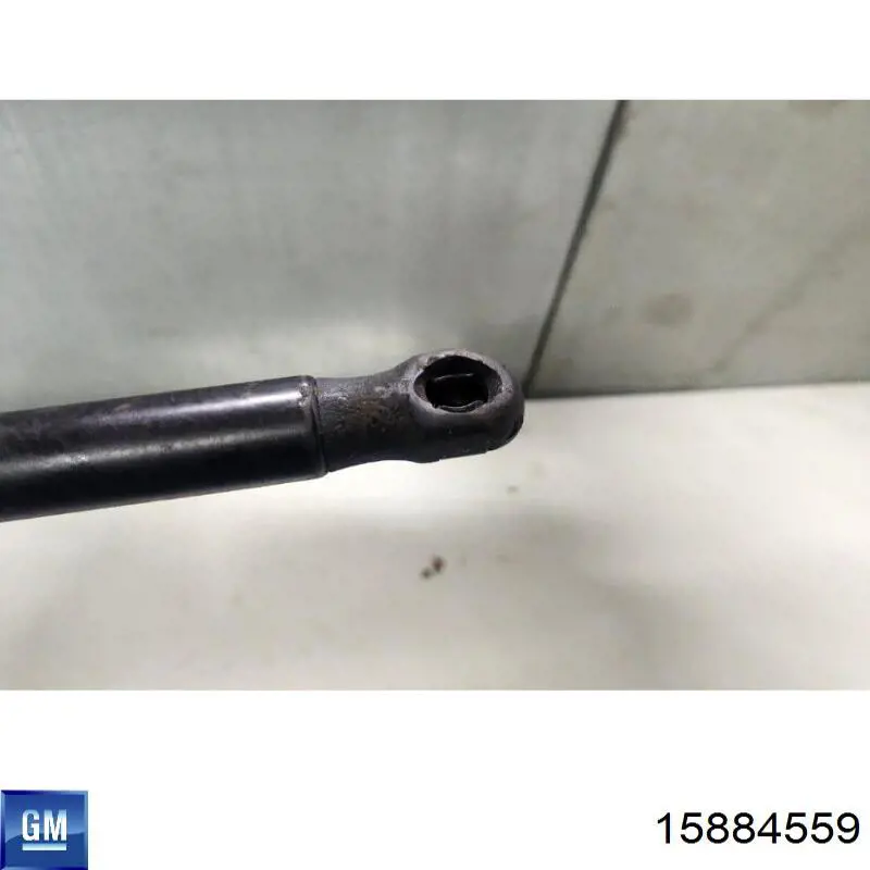 Амортизатор капота 15884559 General Motors