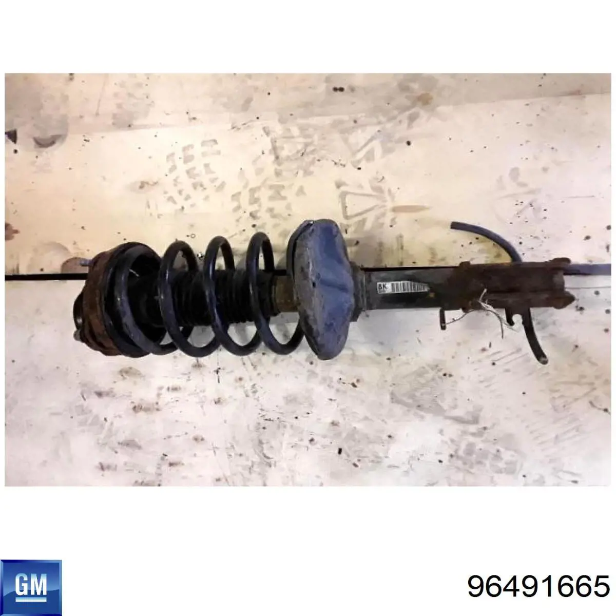 Амортизатора передній лівий 96491665 General Motors