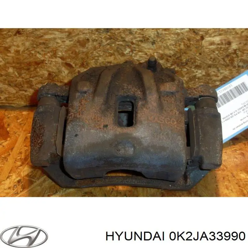 Купити 0K2JA33990 Hyundai/Kia Супорт гальмівний передній лівий