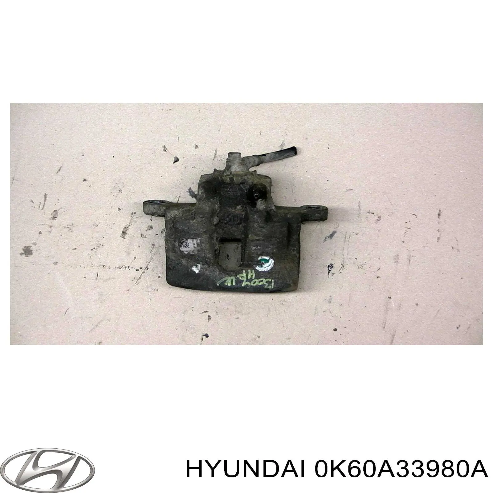 Супорт гальмівний передній правий 0K60A33980A Hyundai/Kia