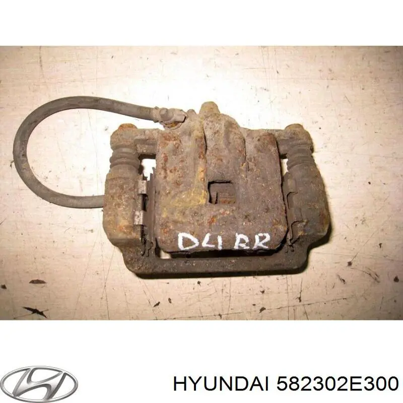 Супорт задній правий 582302E300 Hyundai/Kia