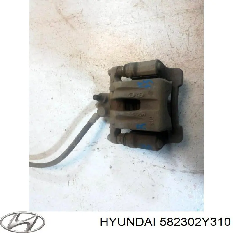 Супорт задній правий 582302Y310 Hyundai/Kia