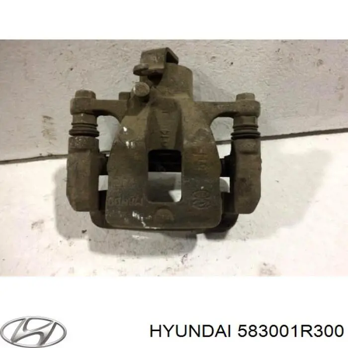 583001R300 Hyundai/Kia супорт гальмівний задній лівий