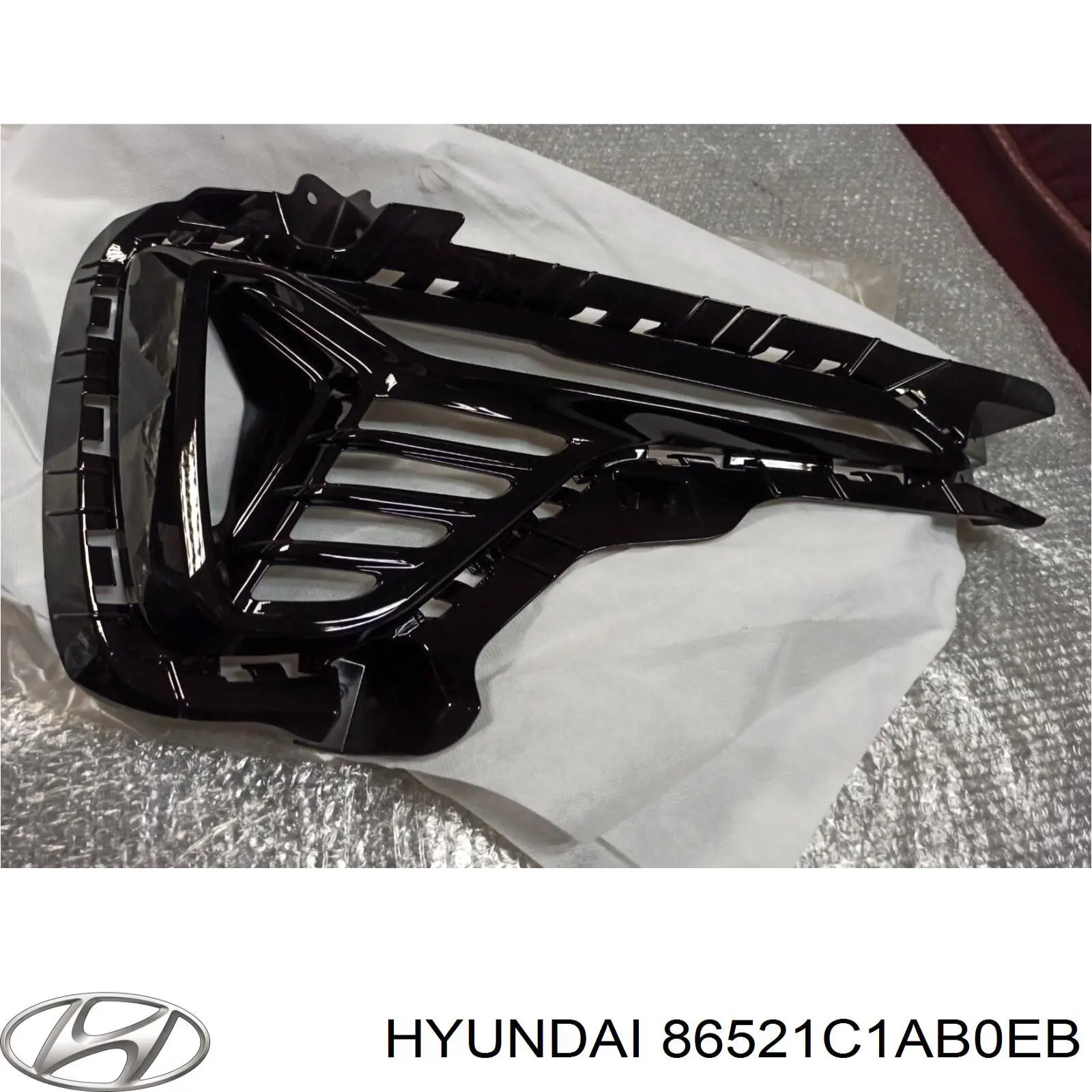 Обід (окантовка) фари протитуманної, лівої 86521C1AB0EB Hyundai/Kia