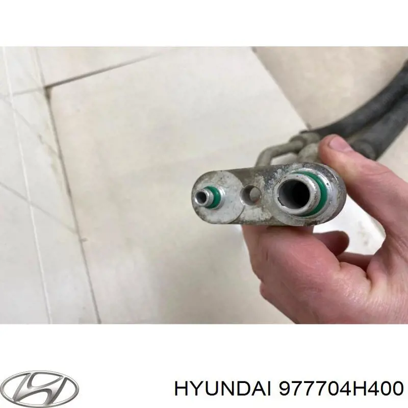 Шланг кондиціонера, від заднього випарювача до компресора Hyundai H-1 STAREX Starex (TQ) (Хендай H-1 STAREX)