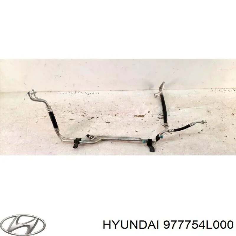 977754L000 Hyundai/Kia шланг кондиціонера, від компресора до радіатора