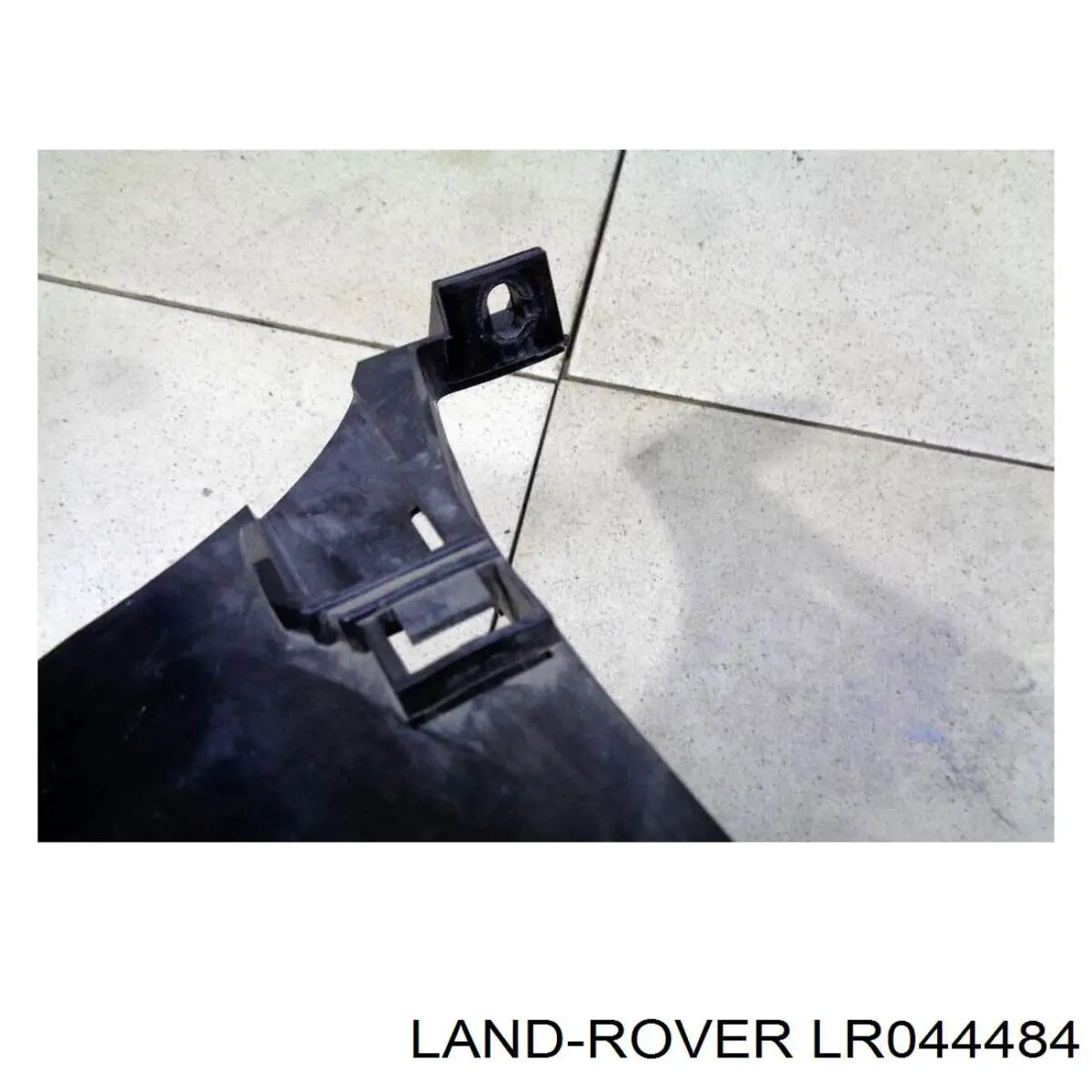 Кронштейн-адаптер кріплення фари передньої, лівою LR044484 Land Rover