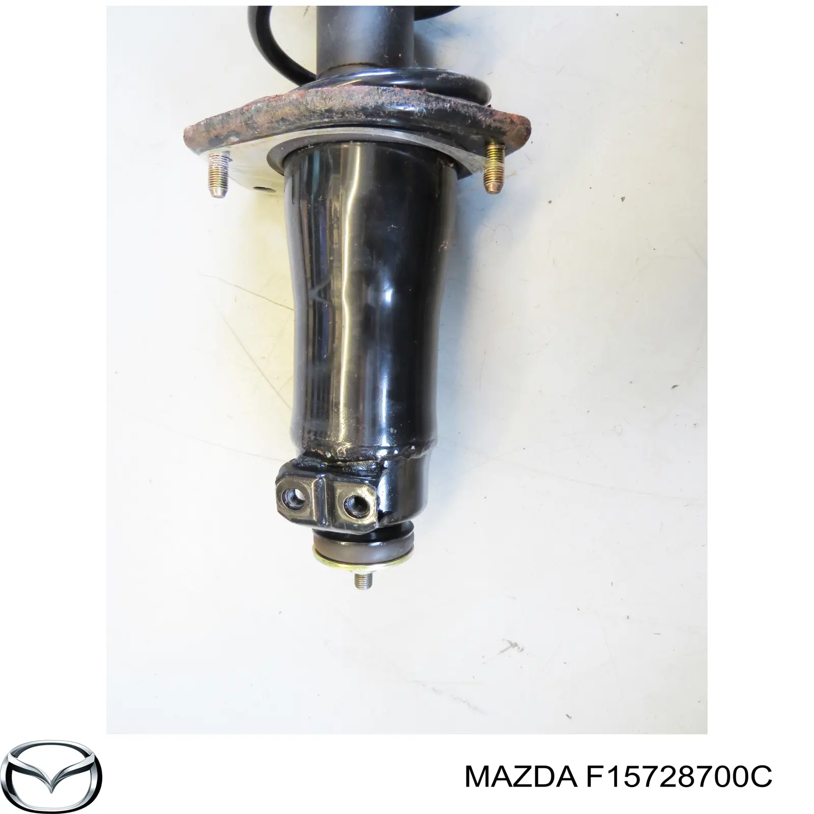Задній амортизатор Mazda F15728700C