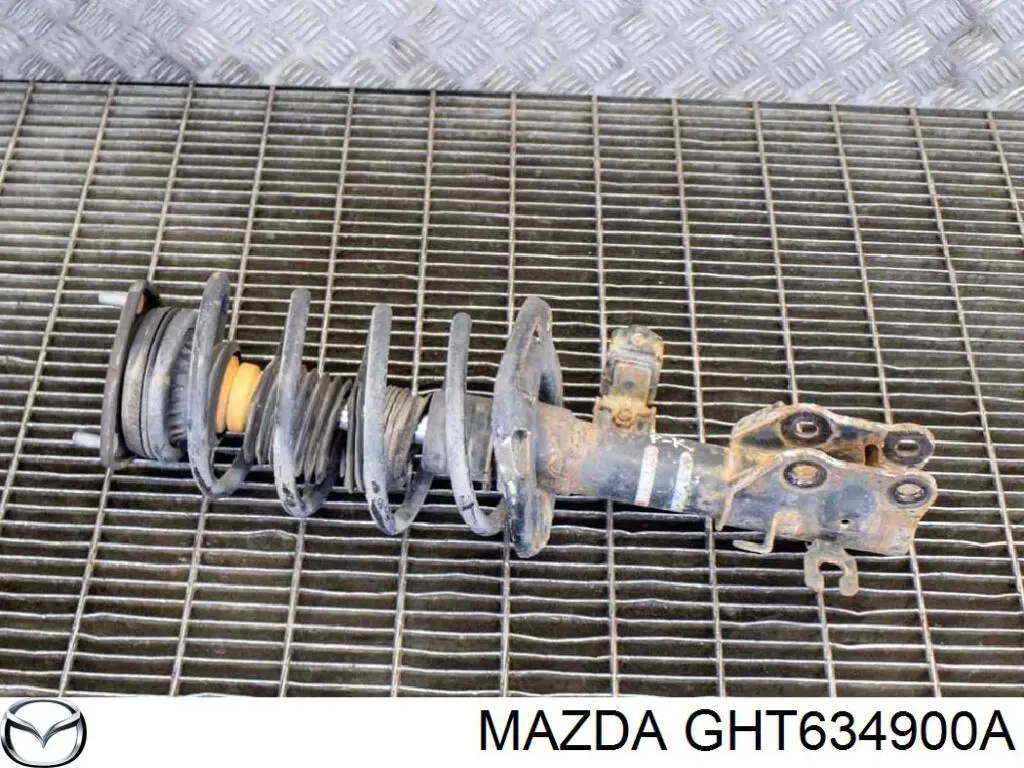Амортизатор передній, лівий GHT634900A Mazda