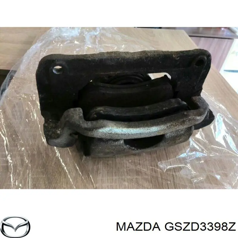 Супорт гальмівний передній правий GSZD3398Z Mazda