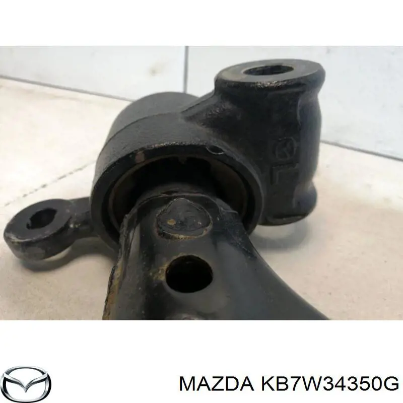Важіль передньої підвіски нижній, лівий KB7W34350F Mazda