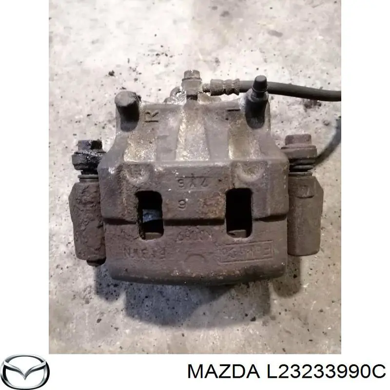 L23233990C Mazda Супорт тормзной