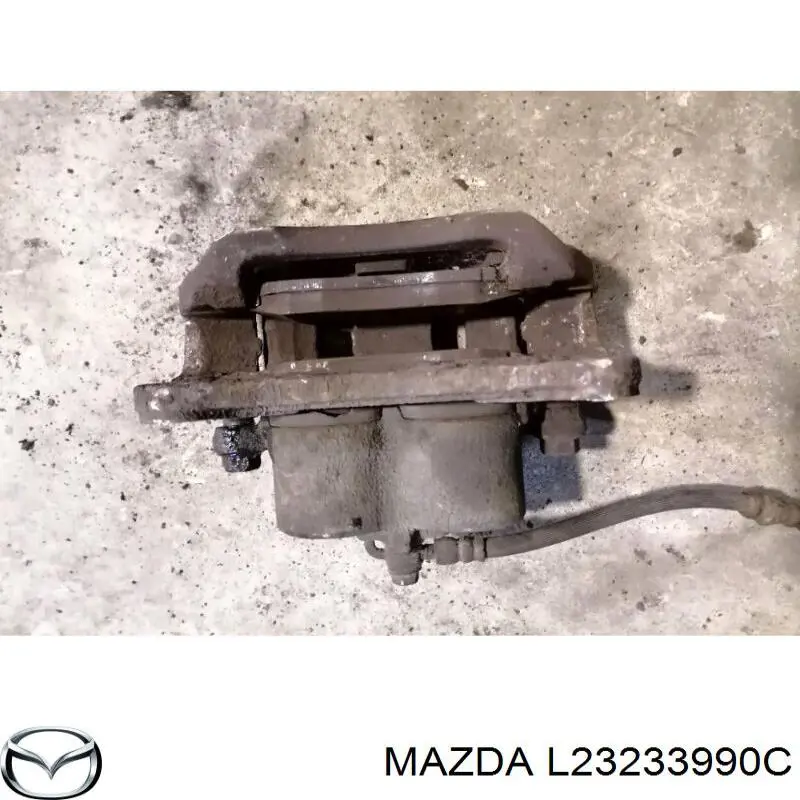Купити L23233990C Mazda Супорт гальмівний передній лівий