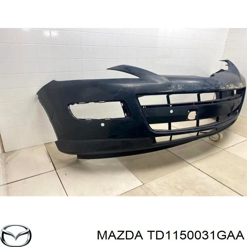 Передній бампер TD1150031GAA Mazda