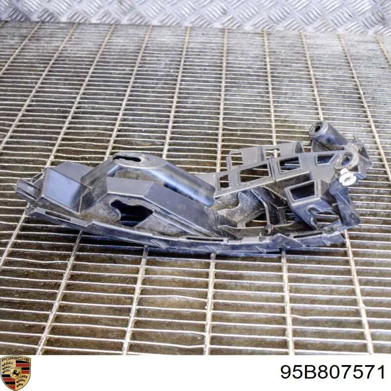 Купити 95B807571 Porsche Лівий кронштейн кріплення бампера заднього