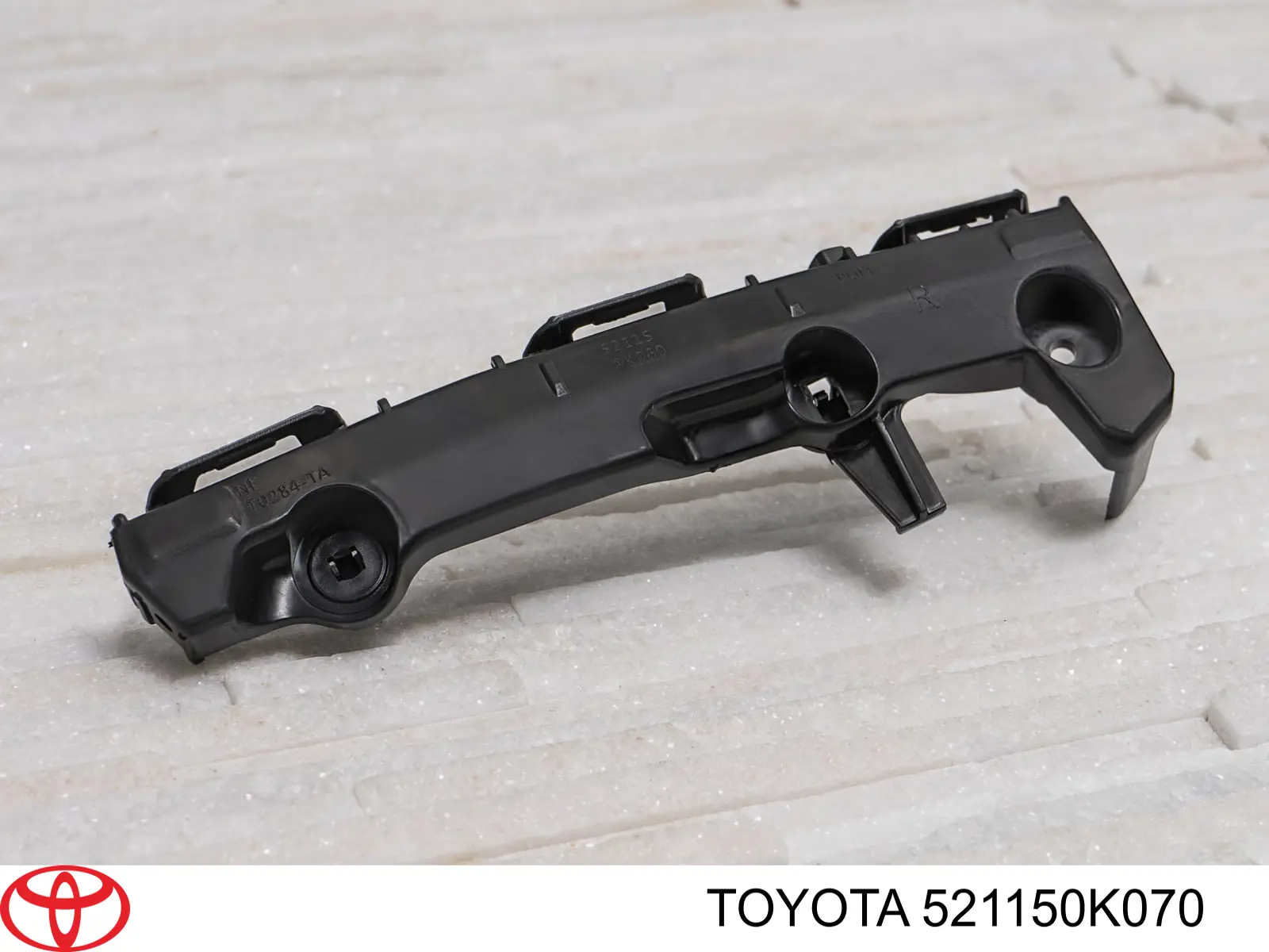 Купити 521150K070 Toyota Кронштейн бампера переднього, правий