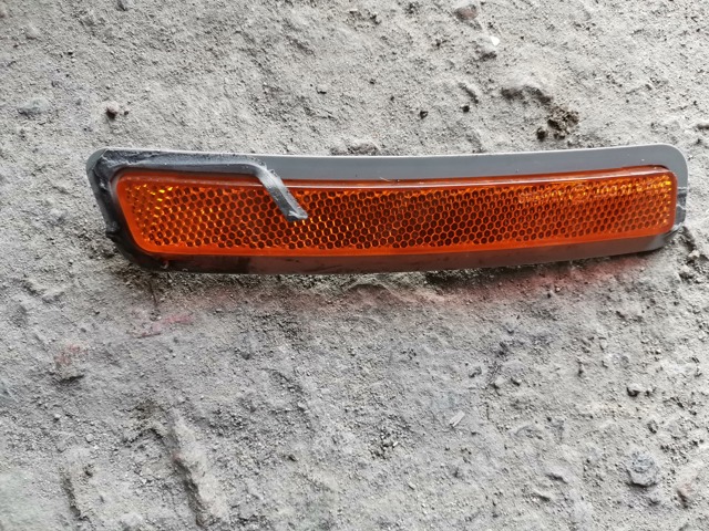 Катафот (відбивач) переднього бампера, лівий 7411973 BMW