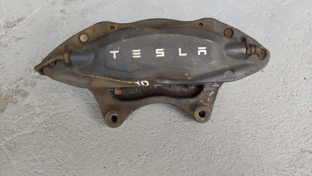 Супорт гальмівний задній правий 102764400A TESLA
