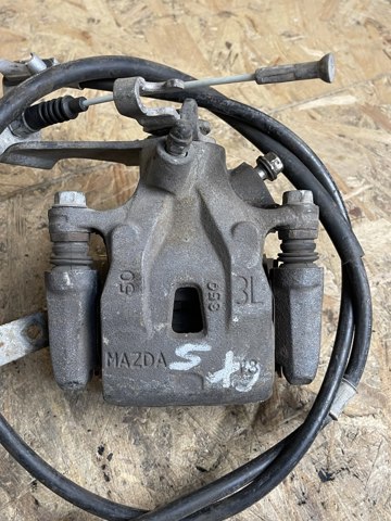 Задній гальмівний супорт лівий K0Y12699Z MAZDA