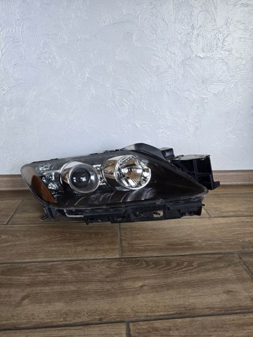 Основна фара - вставка EH1051030 MAZDA