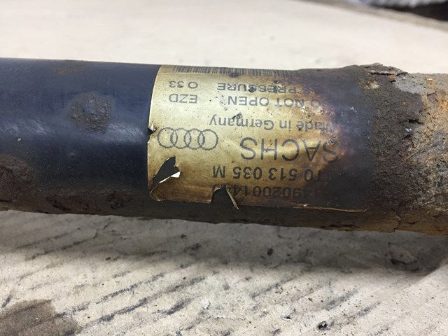 Стійка амортизатора задня 8T0513035M VAG