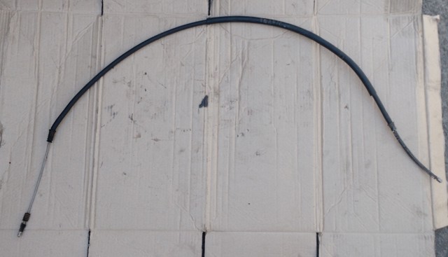 Трос стоянкового гальма задній лівий 7700307720 RENAULT