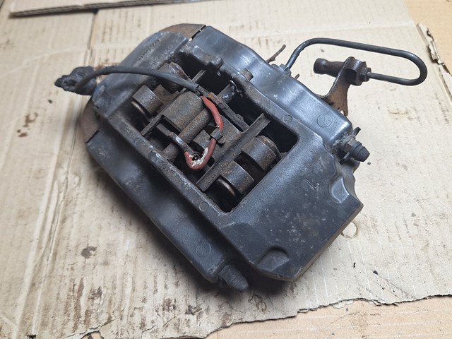 Задній гальмівний супорт лівий 7L6615423L VAG