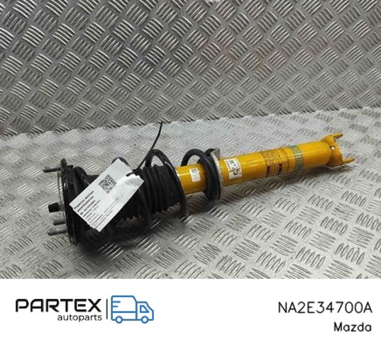 Стойка амортизатора передняя NA2E34700A MAZDA