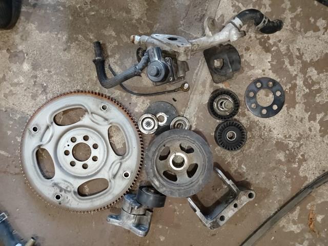 Натягувач приводного ременя 1345A079 MITSUBISHI