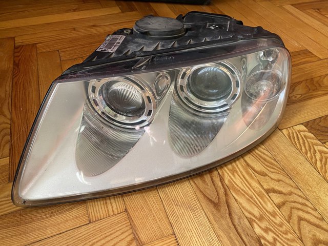Фара основна ліва 7L6941015BK VAG