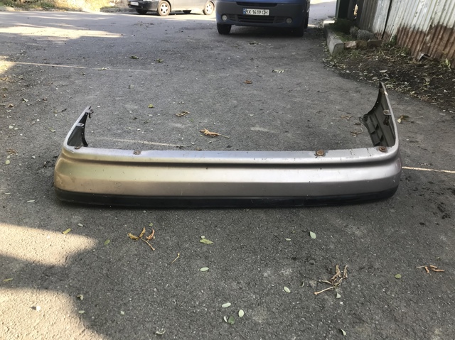 Бампер задній G21150221 MAZDA
