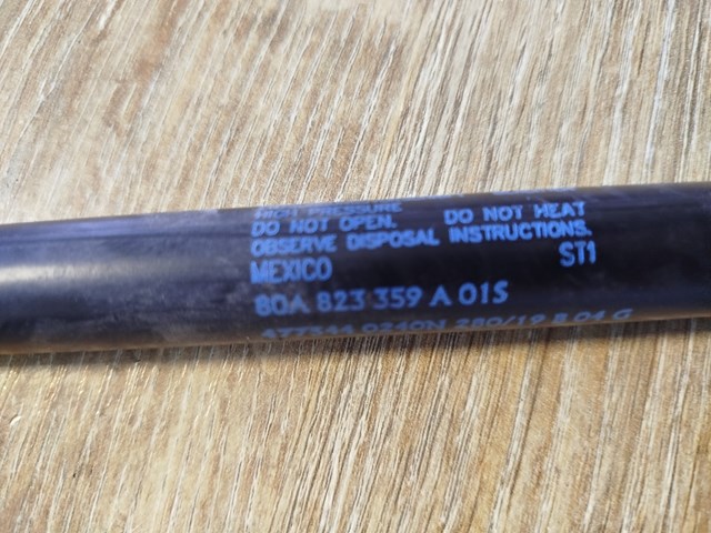 Упор капота 80A823359A VAG