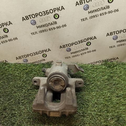 Задній гальмівний супорт лівий 6R0615423 VAG
