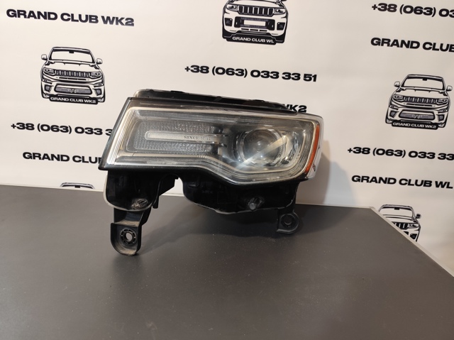 Блок фара ліва 68111001AD CHRYSLER