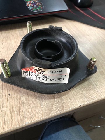 Подушка амортизатора переднього B01C34380 MAZDA