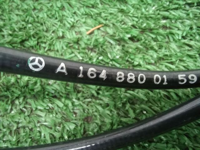 Трос капота A1648800159 MERCEDES