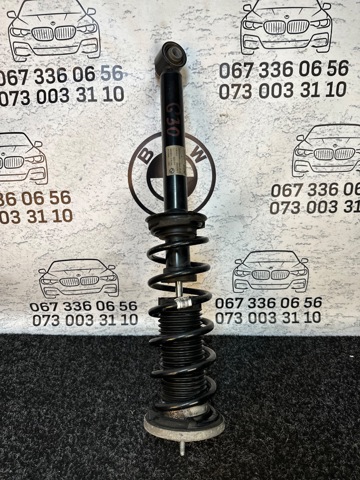 Стійка амортизатора задня 33526866615 BMW