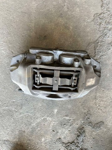 Супорт гальмівний, передній, лівий 104462100D Tesla Model