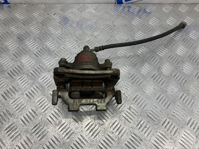 Задній гальмівний супорт лівий 440111AA0A NISSAN