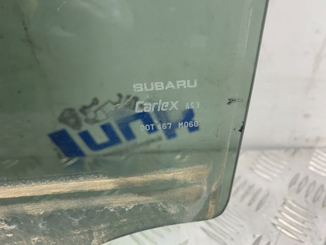 Скло заднє ліве 62011AL13A SUBARU