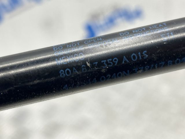 Амортизатор капота газовий 80A823359A VAG