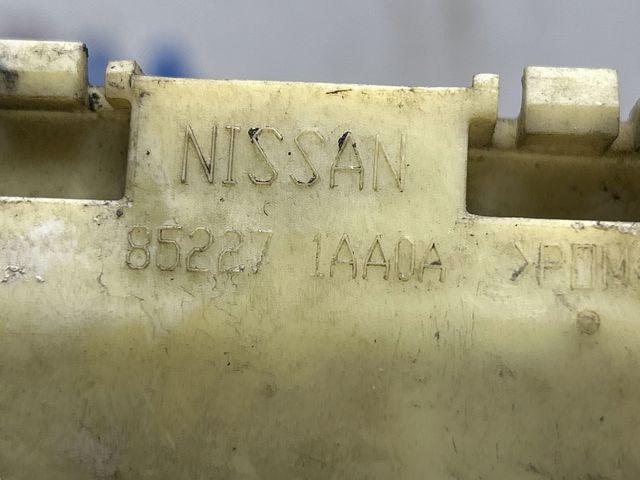 Лівий кронштейн кріплення бампера заднього 852271AA0A NISSAN