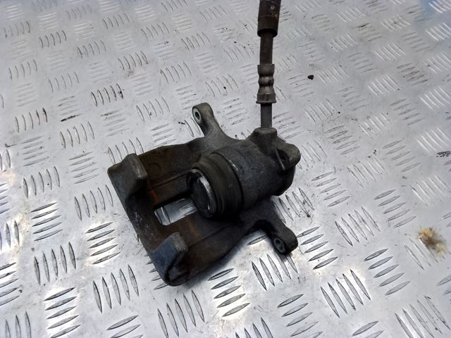 Задній гальмівний супорт лівий 8K0615403E VAG