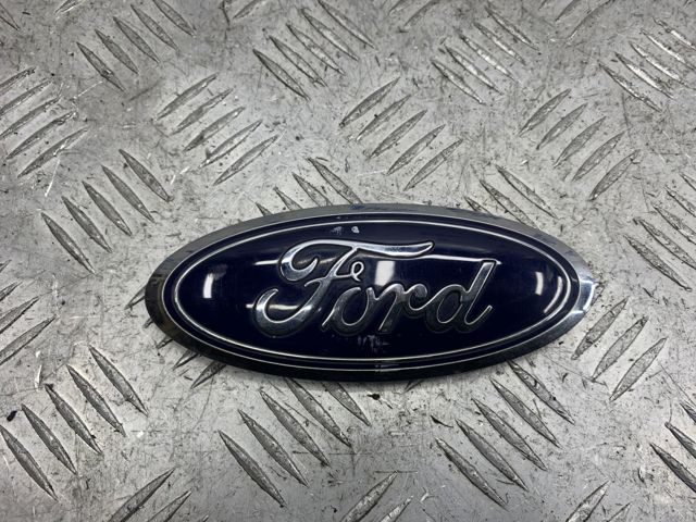 Емблема на кришку багажника, фірм.значок FT4Z9942528A FORD