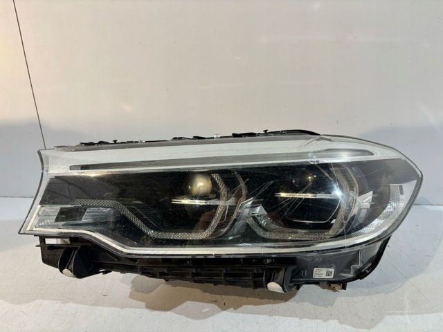 Блок фара ліва 7214961 BMW