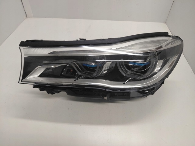 Фара ліва передня 7408703 BMW