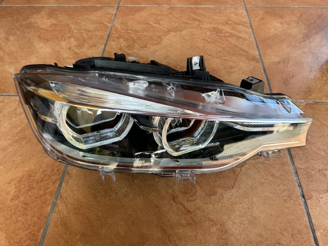 Фара передня права 7419634 BMW