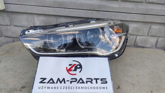 Фара ліва передня 7428735 BMW