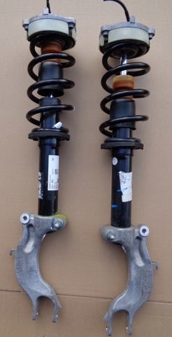 Стойка амортизатора передняя 80A413029G VAG